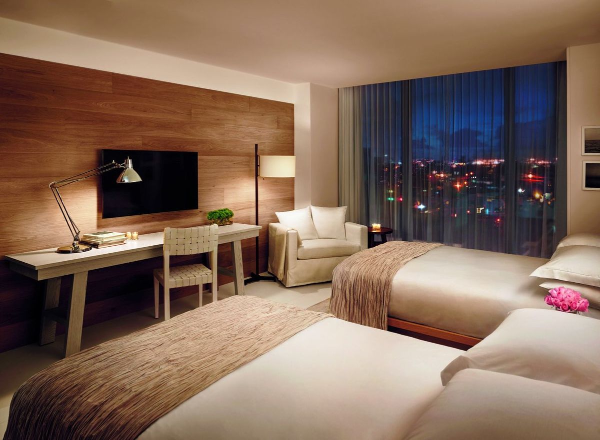 Room desk area with task lighting and charging access